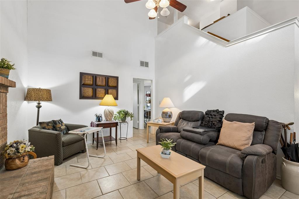 1317 Trinity View Street Irving, TX 75060 - Photo 15 of 31 a living room with furniture a chandelier and a rug