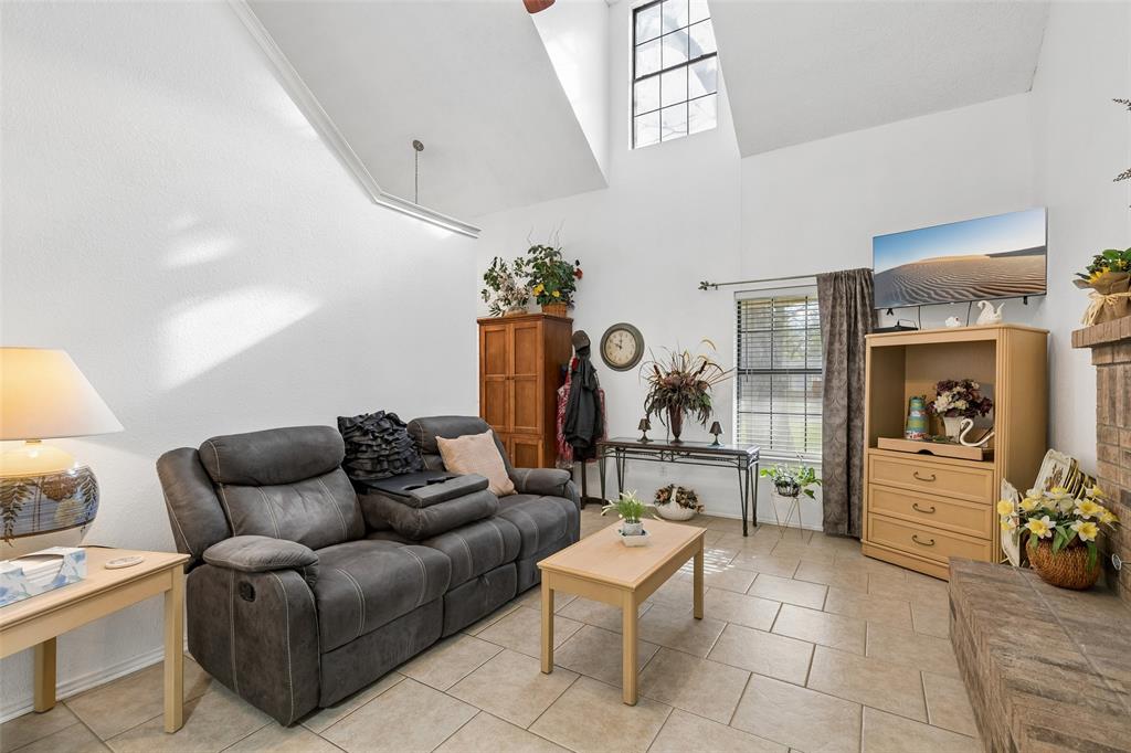 1317 Trinity View Street Irving, TX 75060 - Photo 16 of 31 a living room with furniture a rug and white walls