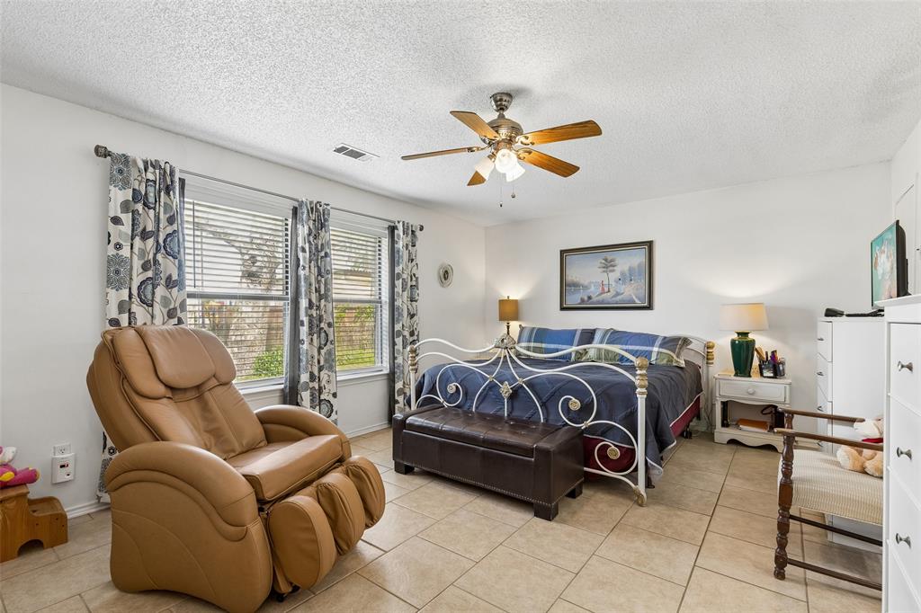 1317 Trinity View Street Irving, TX 75060 - Photo 21 of 31 a bedroom with furniture and a large window
