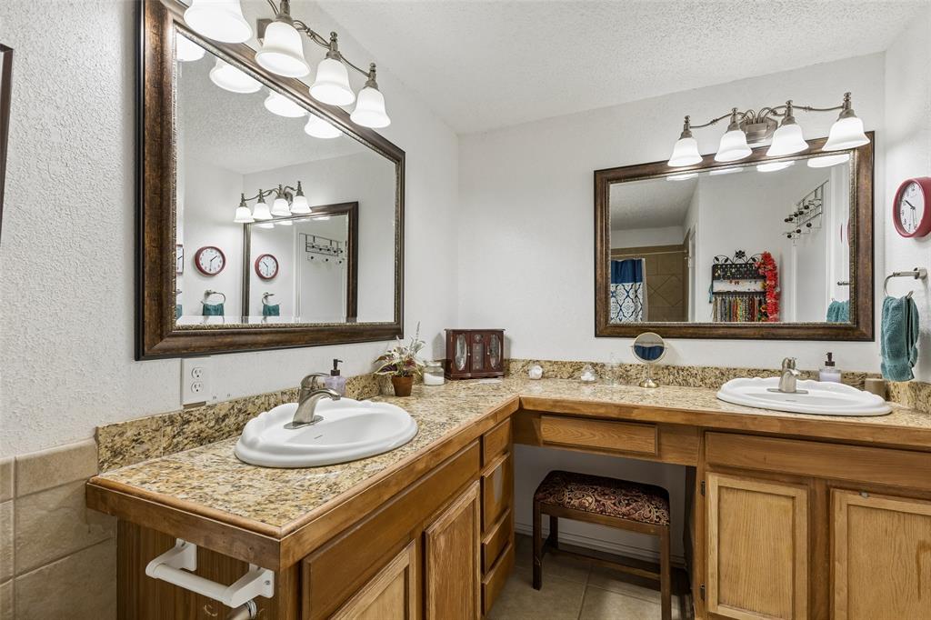 1317 Trinity View Street Irving, TX 75060 - Photo 24 of 31 a bathroom with a sink and a mirror