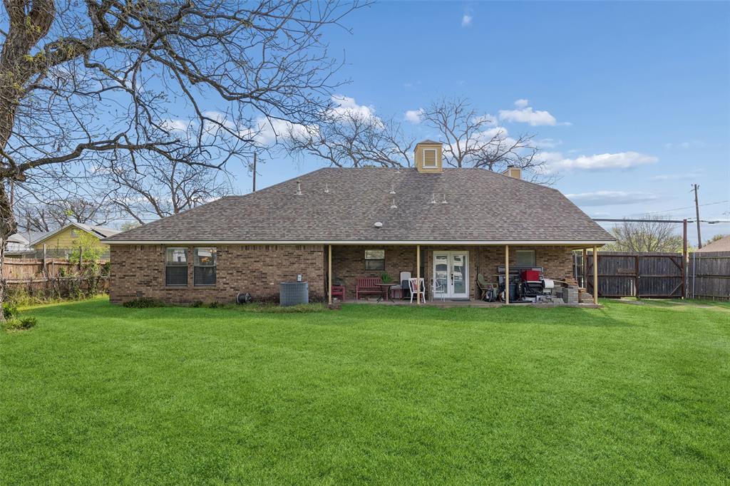 1317 Trinity View Street Irving, TX 75060 - Photo 27 of 31 a view of a big house with a big yard and large tree