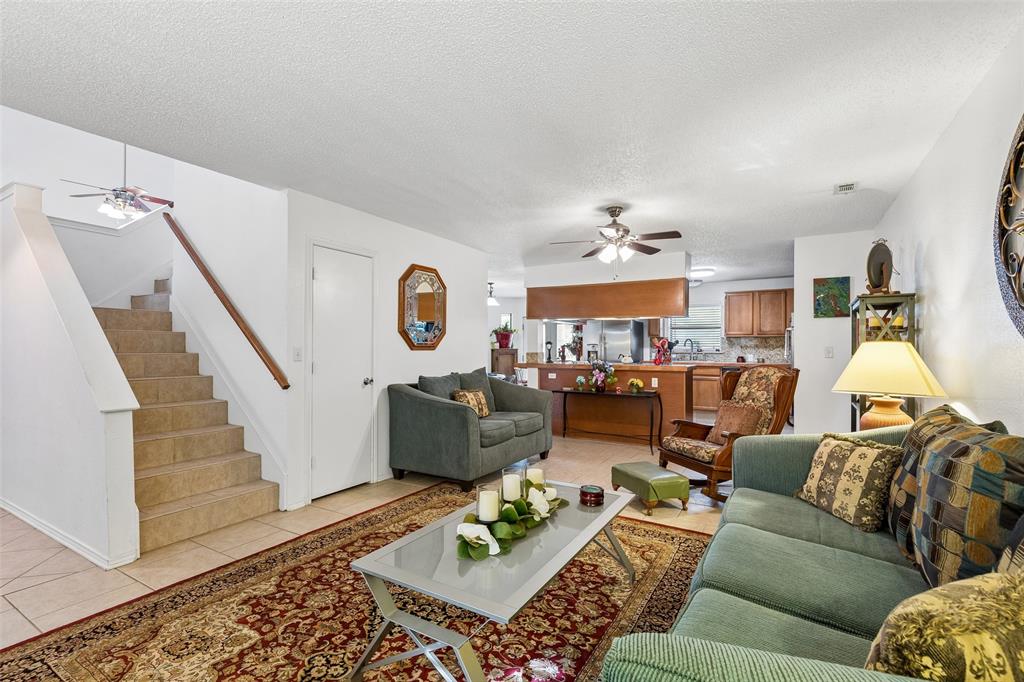 1317 Trinity View Street Irving, TX 75060 - Photo 5 of 31 a living room with furniture and a clock
