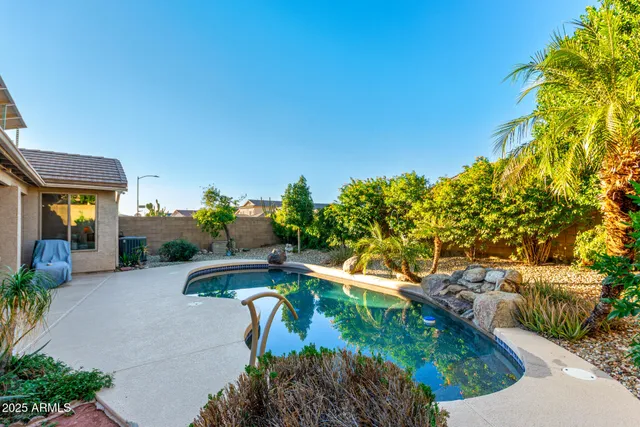 a view of swimming pool from a outdoor seating