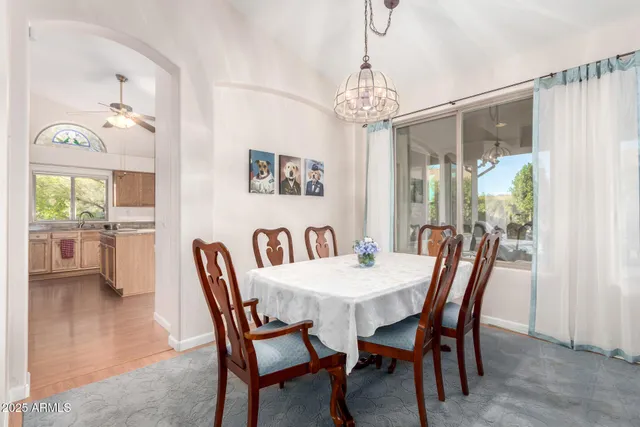 a view of a dining room with furniture window and outside view
