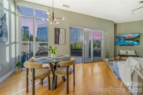 a dining room with furniture and window