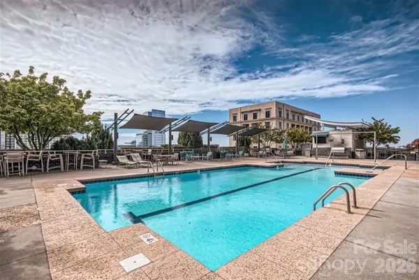 a view of a swimming pool with lounge chair