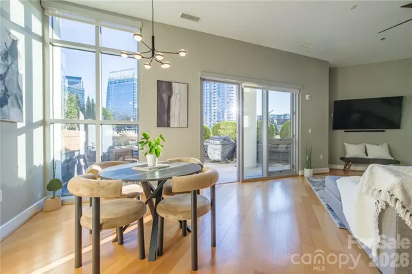 a view of a livingroom with furniture and a flat screen tv