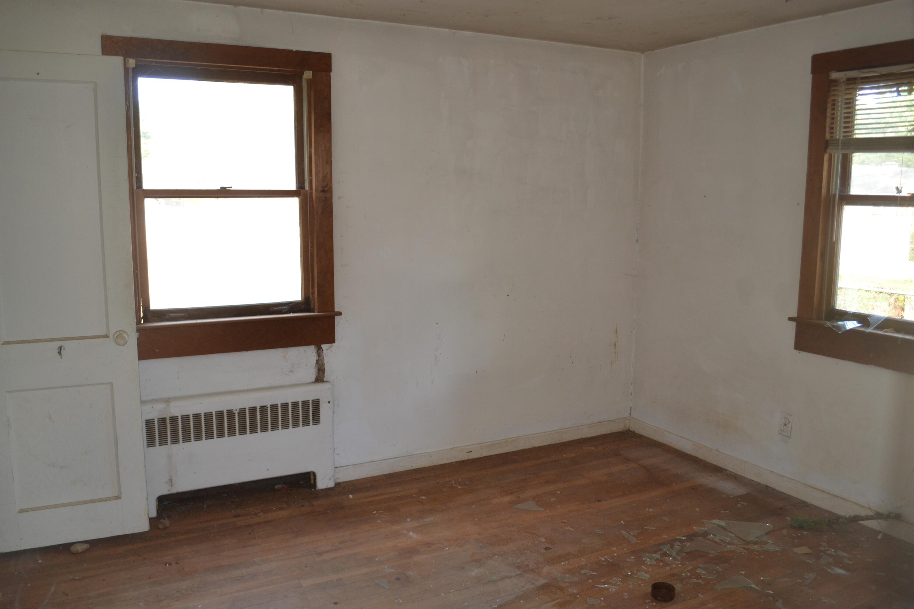 26-28 Hudson Road West Yarmouth, MA 02673 - Photo 9 of 10 an empty room with a window
