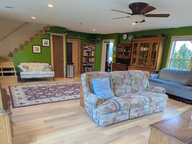 a living room with furniture and a rug