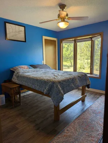 a bedroom with a bed and a table