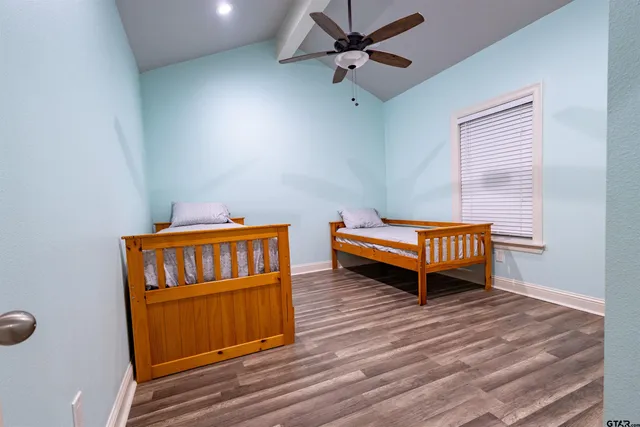 a living room with baby crib furniture and a window