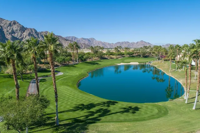 a view of a lake with a yard
