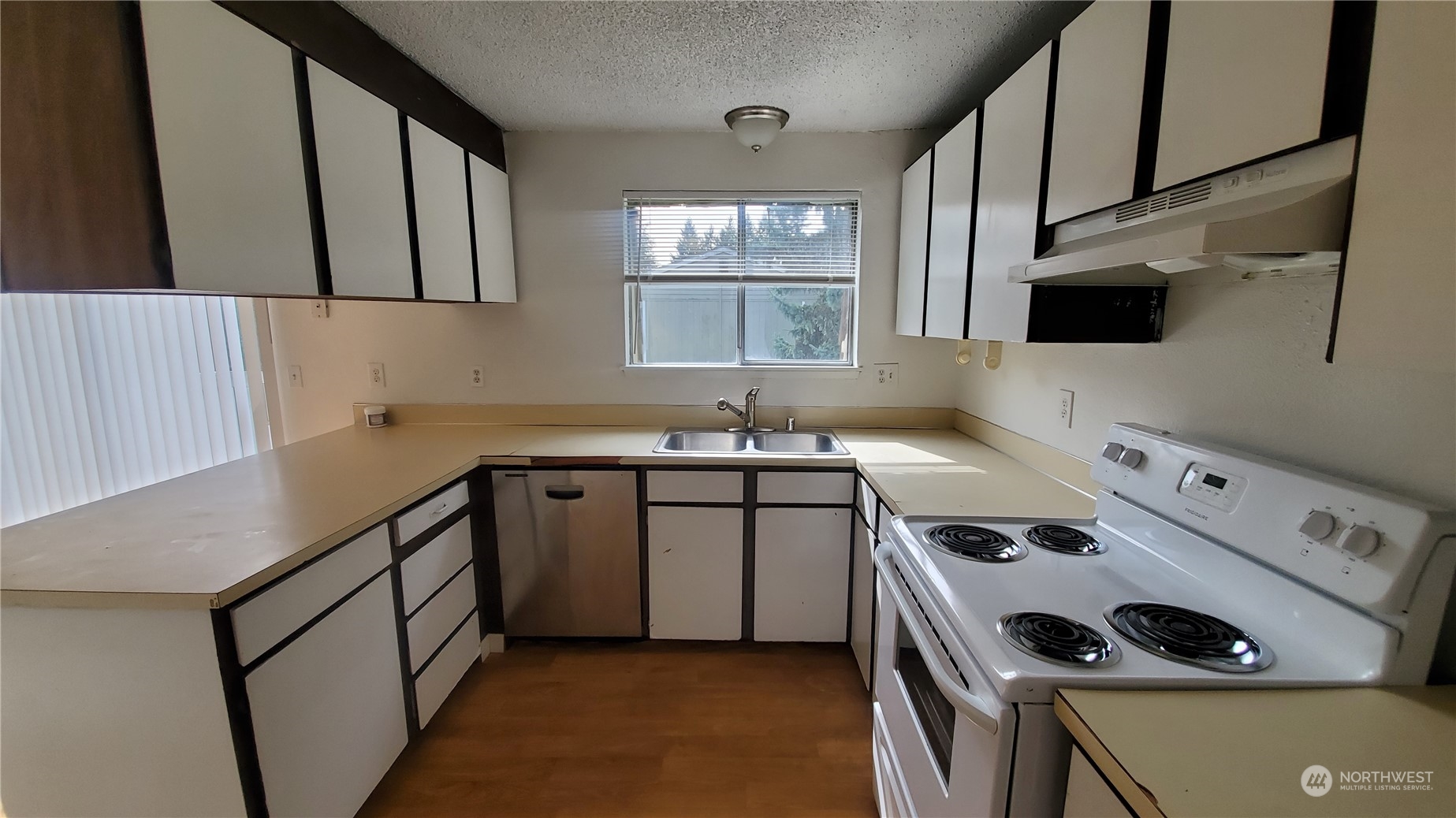 5012 South 58th Street Tacoma, WA 98409 - Photo 14 of 22 a kitchen with a stove and a sink