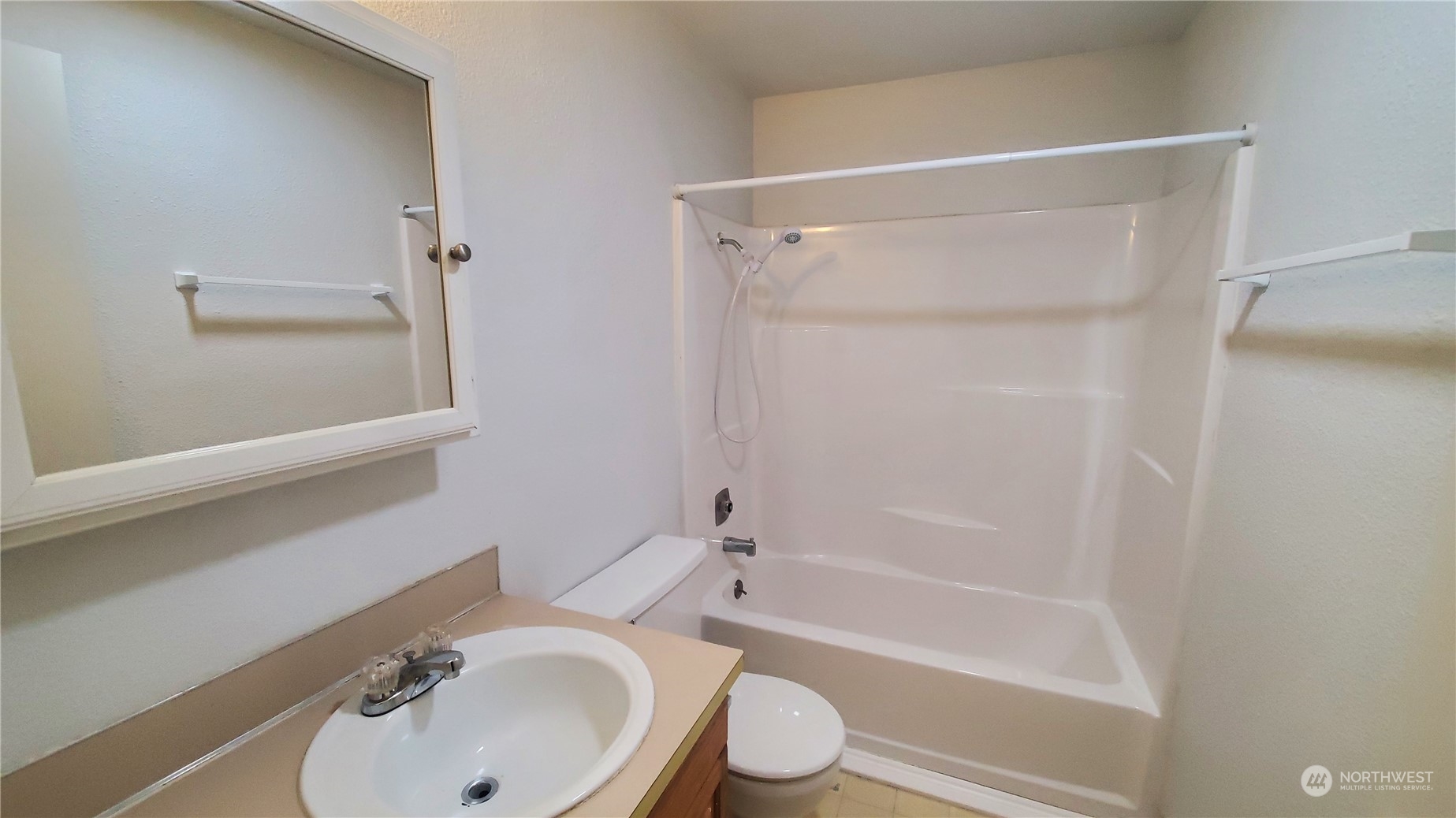 5012 South 58th Street Tacoma, WA 98409 - Photo 17 of 22 a bathroom with a sink toilet and shower
