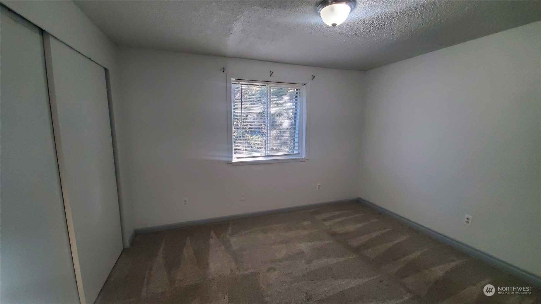5012 South 58th Street Tacoma, WA 98409 - Photo 18 of 22 an empty room with windows and closet