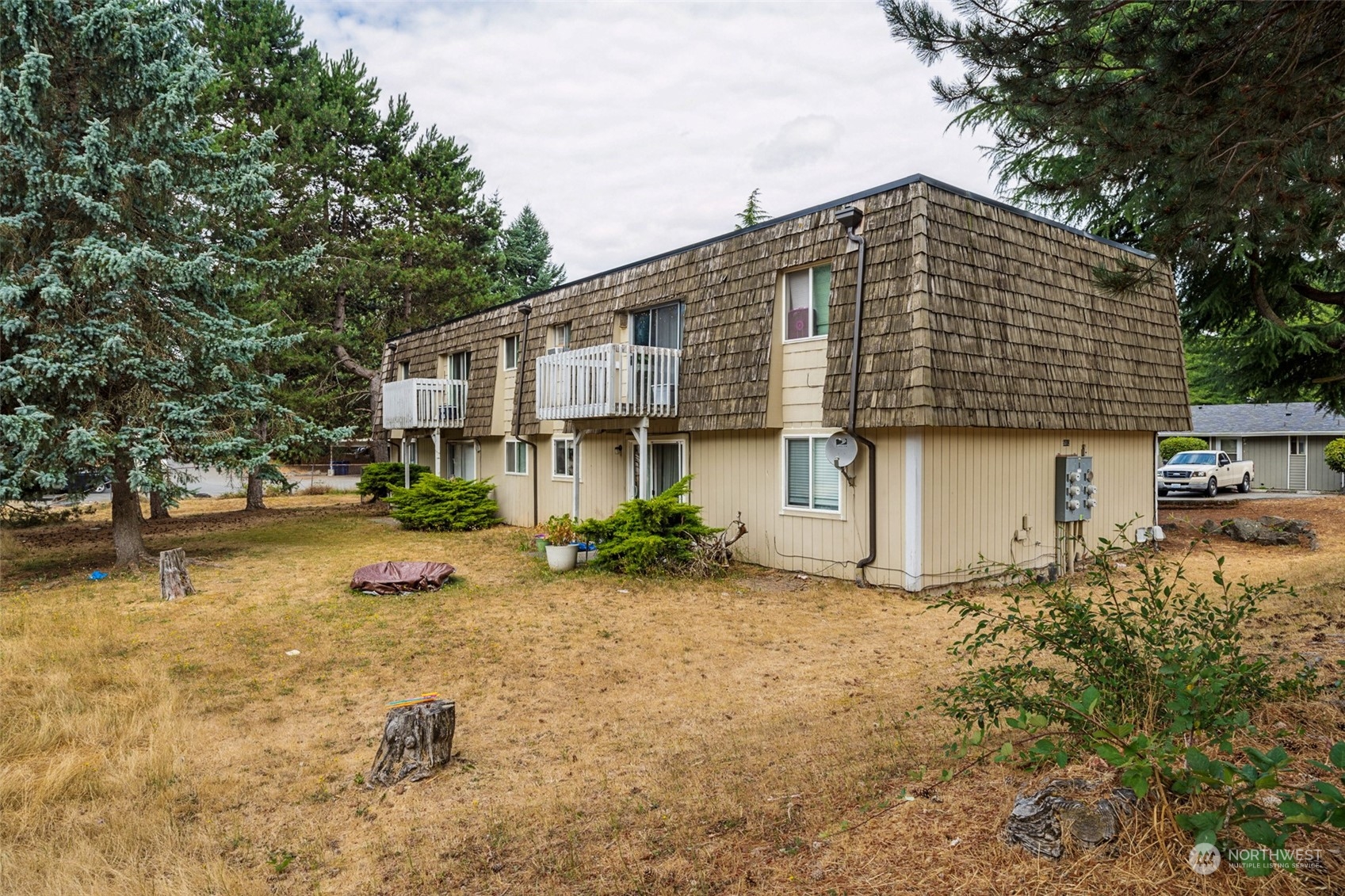 5012 South 58th Street Tacoma, WA 98409 - Photo 21 of 22 a front view of a house with a yard