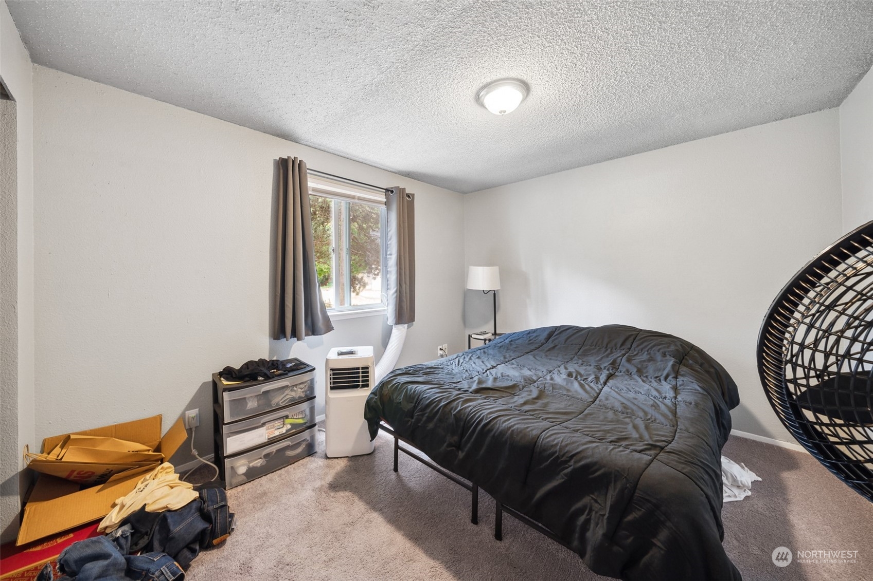 5012 South 58th Street Tacoma, WA 98409 - Photo 6 of 22 a bedroom with bed and a window