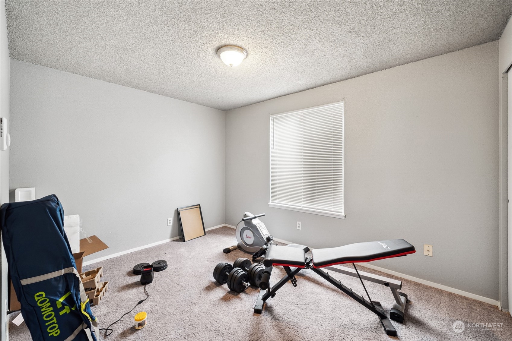 5012 South 58th Street Tacoma, WA 98409 - Photo 7 of 22 a room with furniture and a window