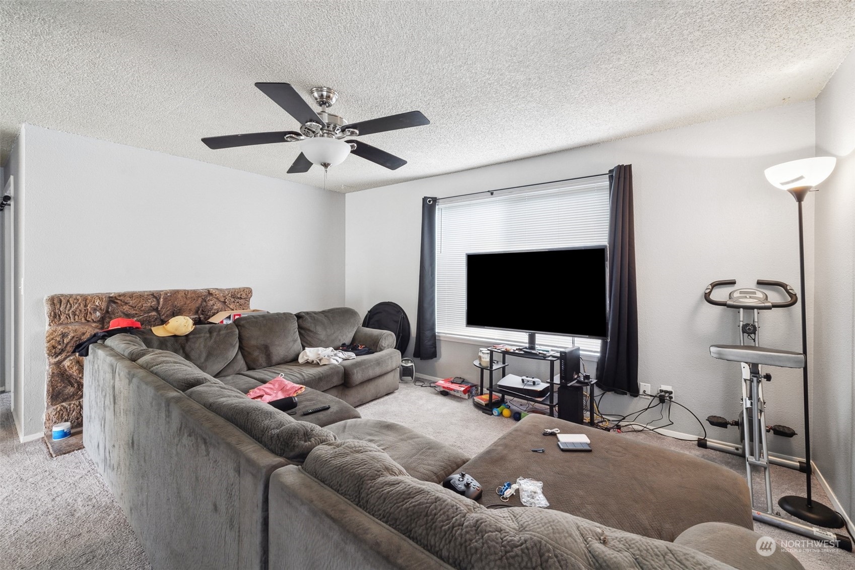 5012 South 58th Street Tacoma, WA 98409 - Photo 10 of 22 a living room with furniture and a flat screen tv