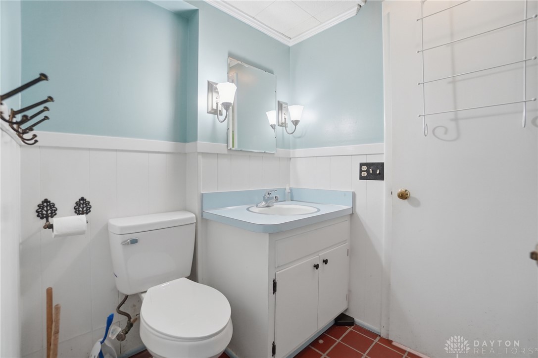 6119 Flemington Road Dayton, OH 45459 - Photo 51 of 76 This bright bathroom features a vanity, toilet, and charming tile flooring.