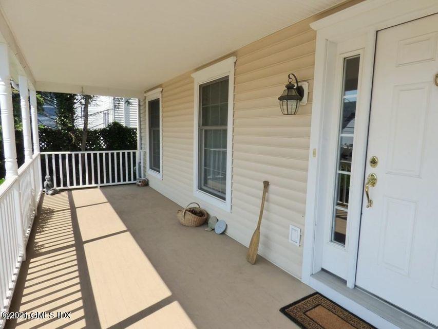 102 River Road Cos Cob, CT 06807 - Photo 2 of 14 a view of a balcony with chair