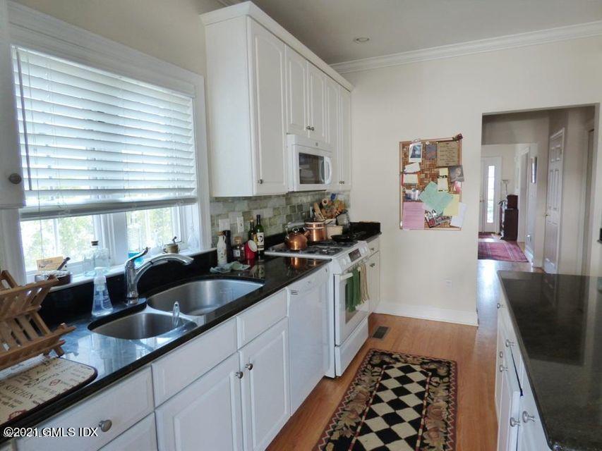 102 River Road Cos Cob, CT 06807 - Photo 9 of 14 a kitchen that has a sink and a stove in it