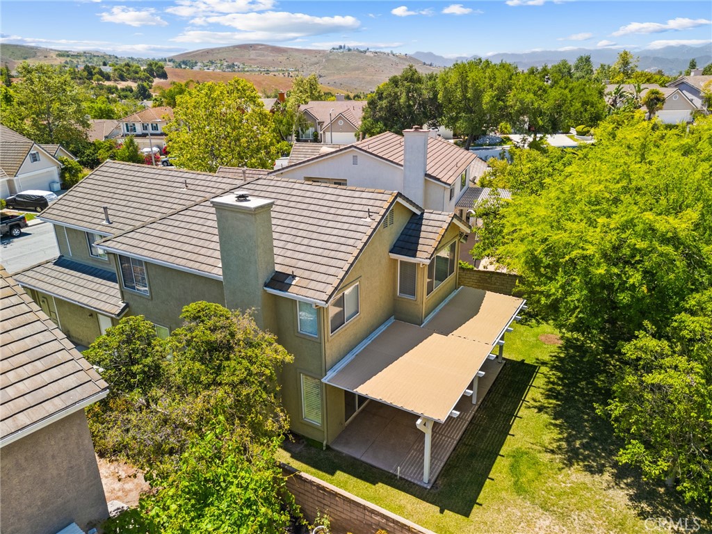 2311 Gillingham Circle Thousand Oaks, CA 91362 - Photo 59 of 71 a view of a patio with table and chairs and potted plants