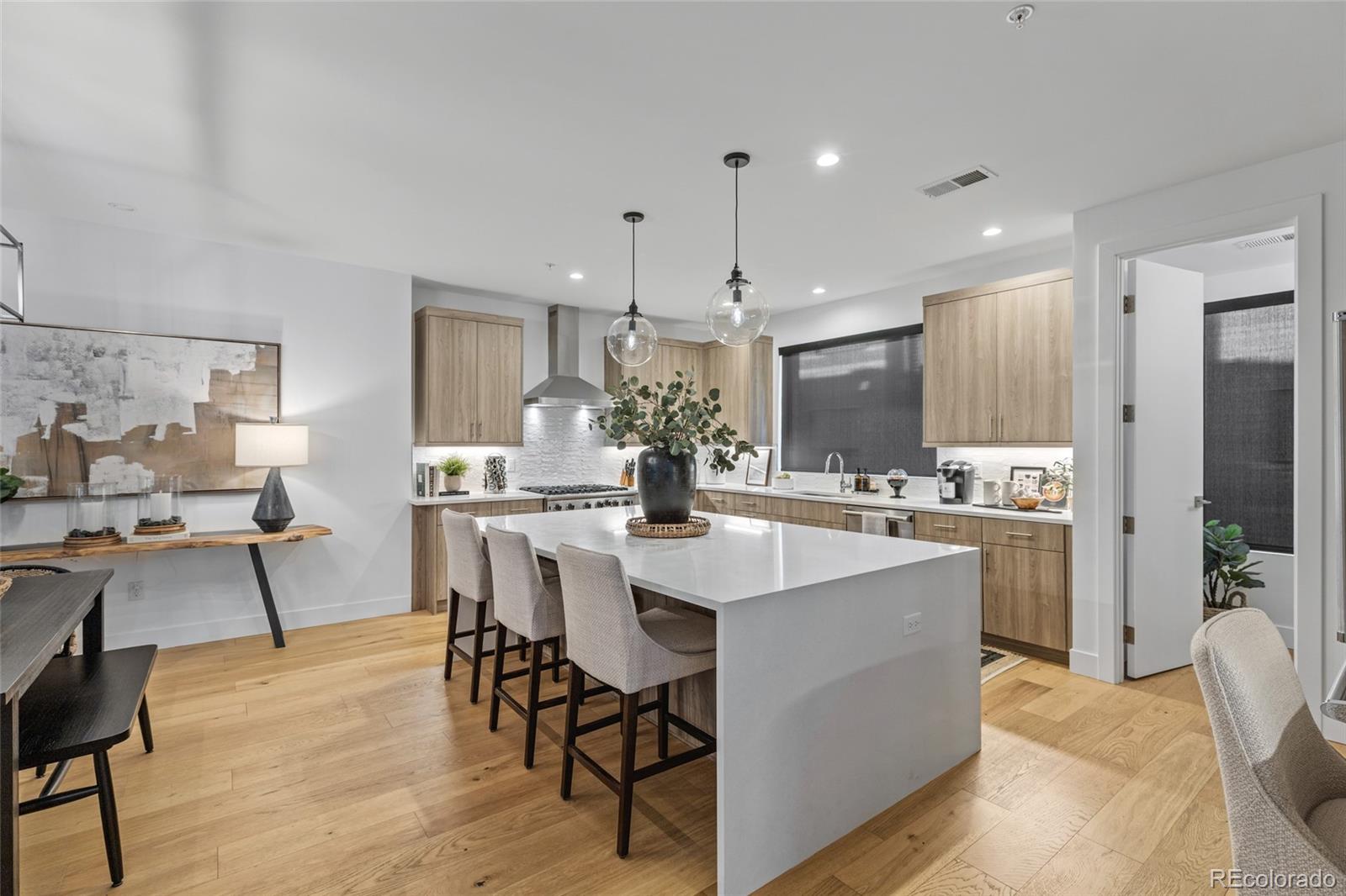 2475 Walnut Street Boulder, CO 80302 - Photo 12 of 50 a kitchen with stainless steel appliances kitchen island granite countertop a sink and cabinets