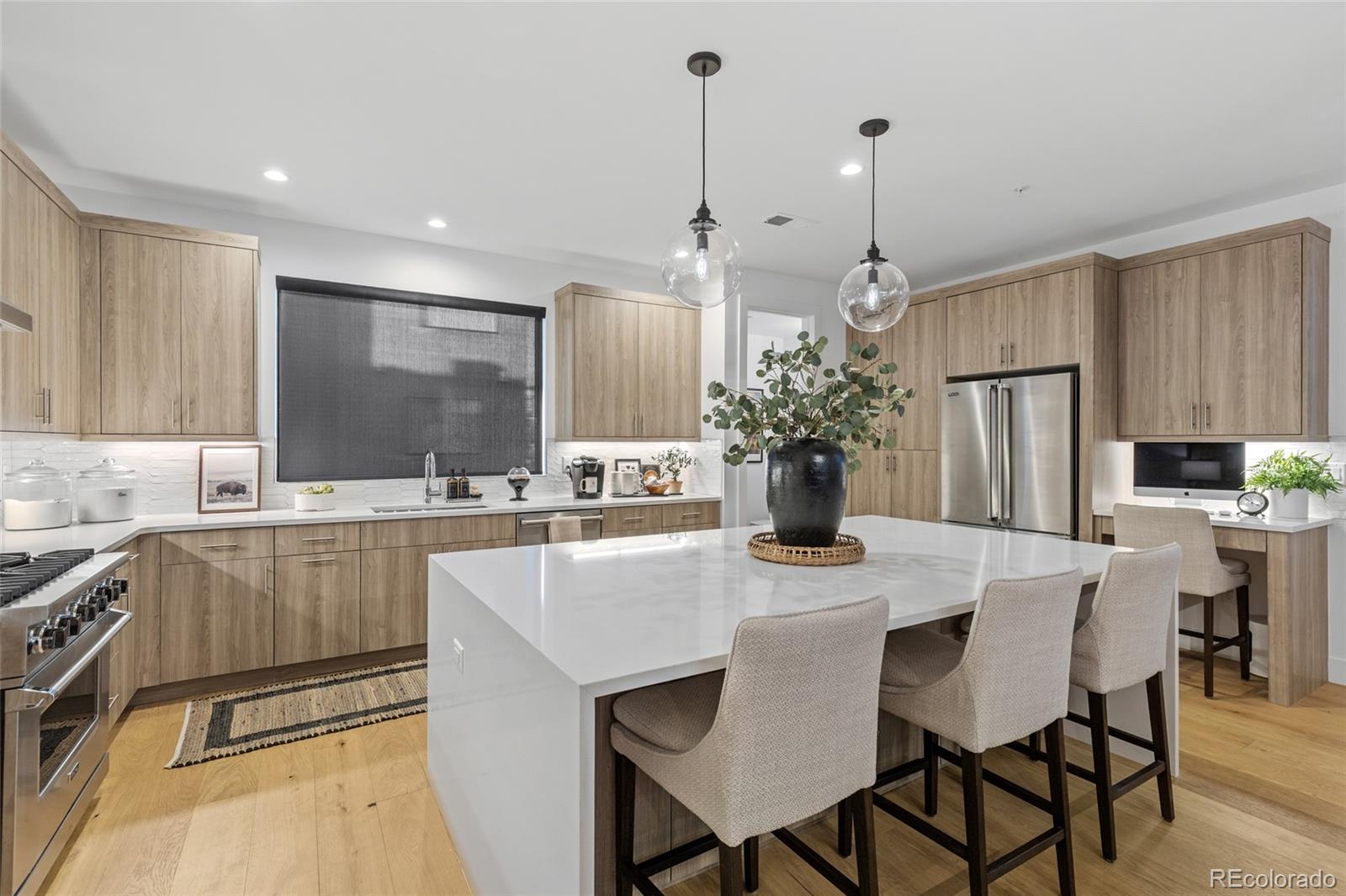 2475 Walnut Street Boulder, CO 80302 - Photo 14 of 50 a kitchen with a table chairs refrigerator and microwave