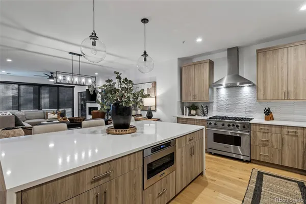 a kitchen with a stove and a white cabinets