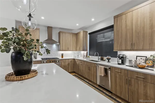 a kitchen with sink and cabinets