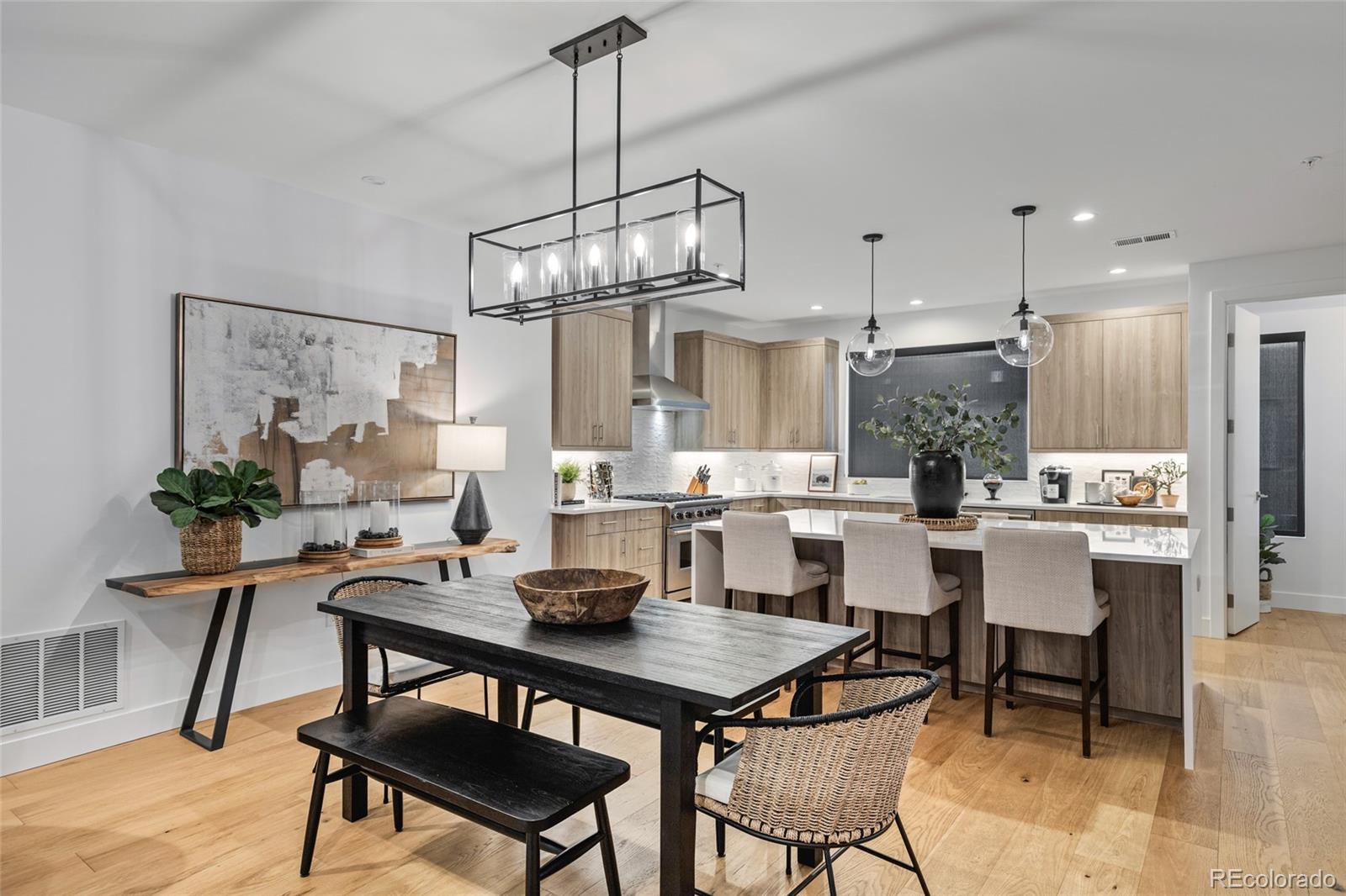 2475 Walnut Street Boulder, CO 80302 - Photo 21 of 50 a view of a dining room with furniture a kitchen and chandelier
