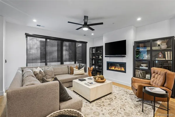 a living room with furniture and a fireplace