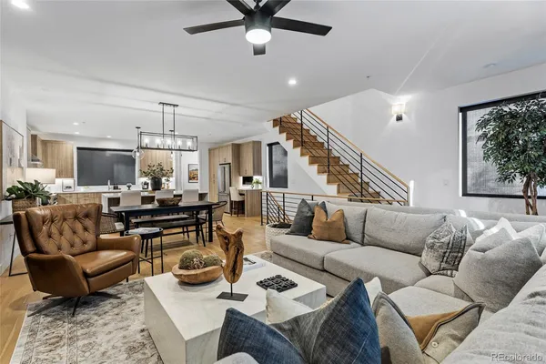 a living room with furniture or couches and a dining table