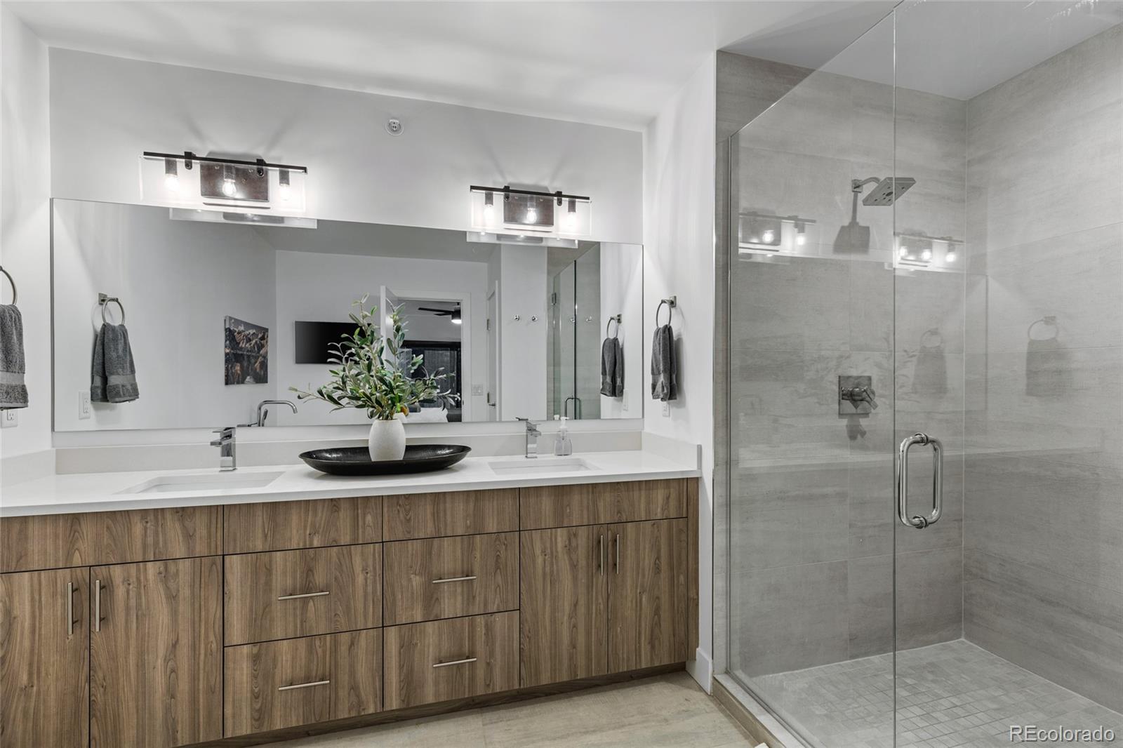 2475 Walnut Street Boulder, CO 80302 - Photo 30 of 50 a bathroom with a double vanity sink mirror and shower