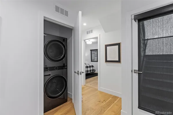 a view of a hallway with washer and dryer