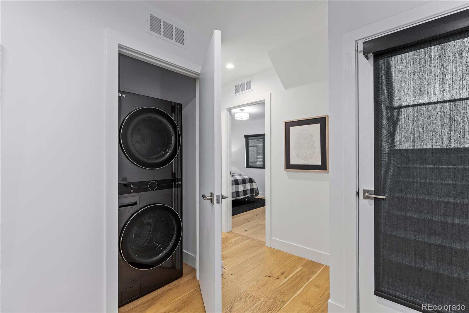 2475 Walnut Street Boulder, CO 80302 - Photo 32 of 50 a view of a hallway with washer and dryer