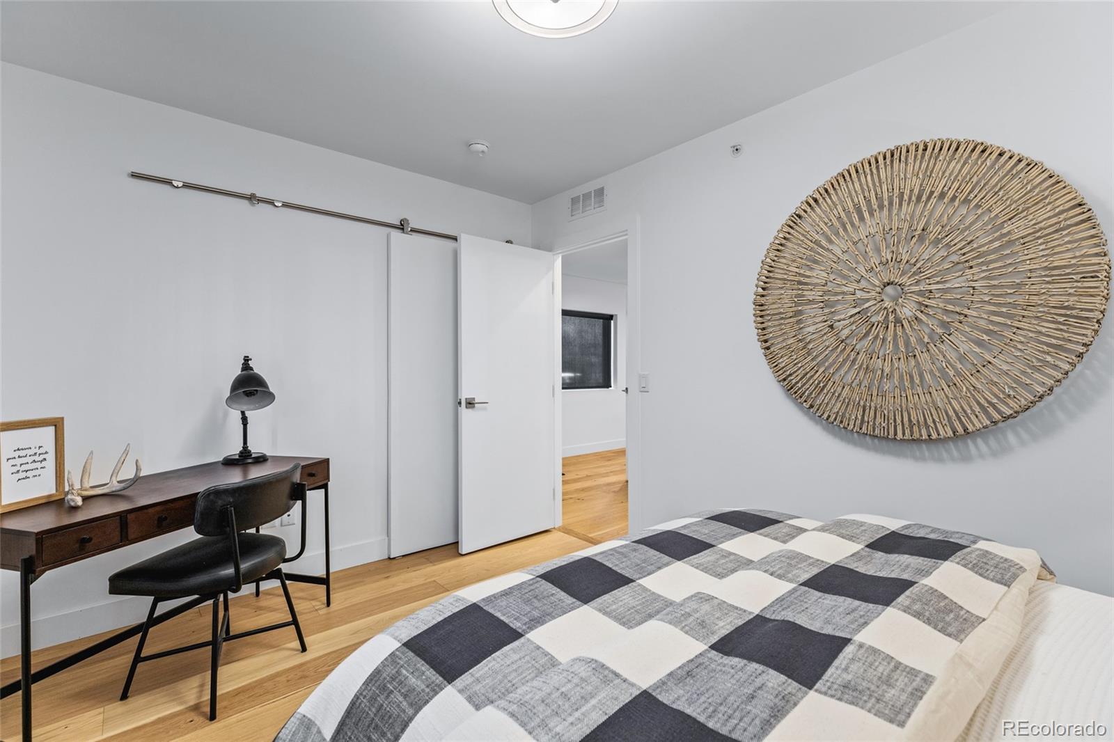 2475 Walnut Street Boulder, CO 80302 - Photo 34 of 50 a bedroom with a bed and a table in it