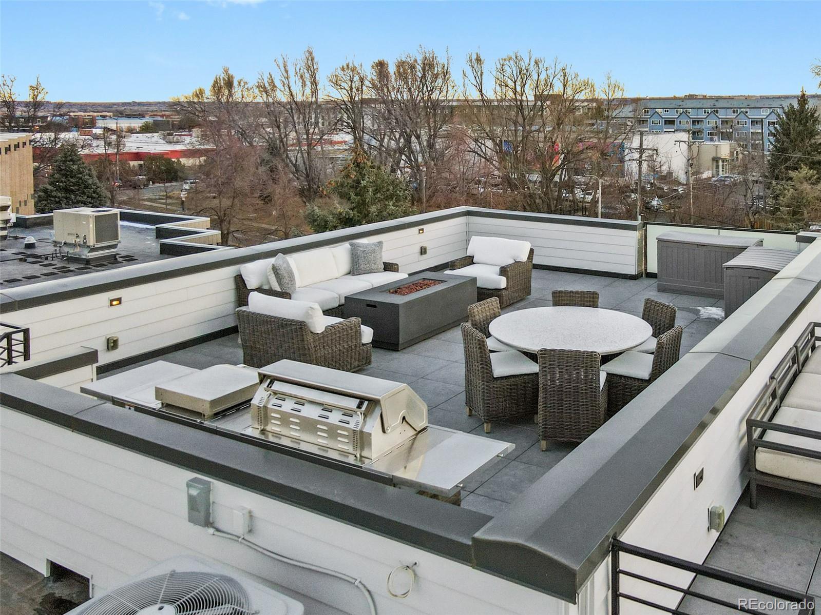 2475 Walnut Street Boulder, CO 80302 - Photo 46 of 50 a view of a balcony with couches and a potted plant on a table