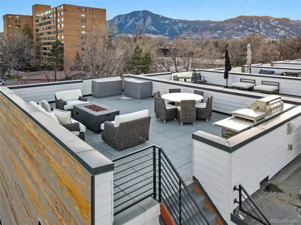 a terrace of a house with outdoor seating