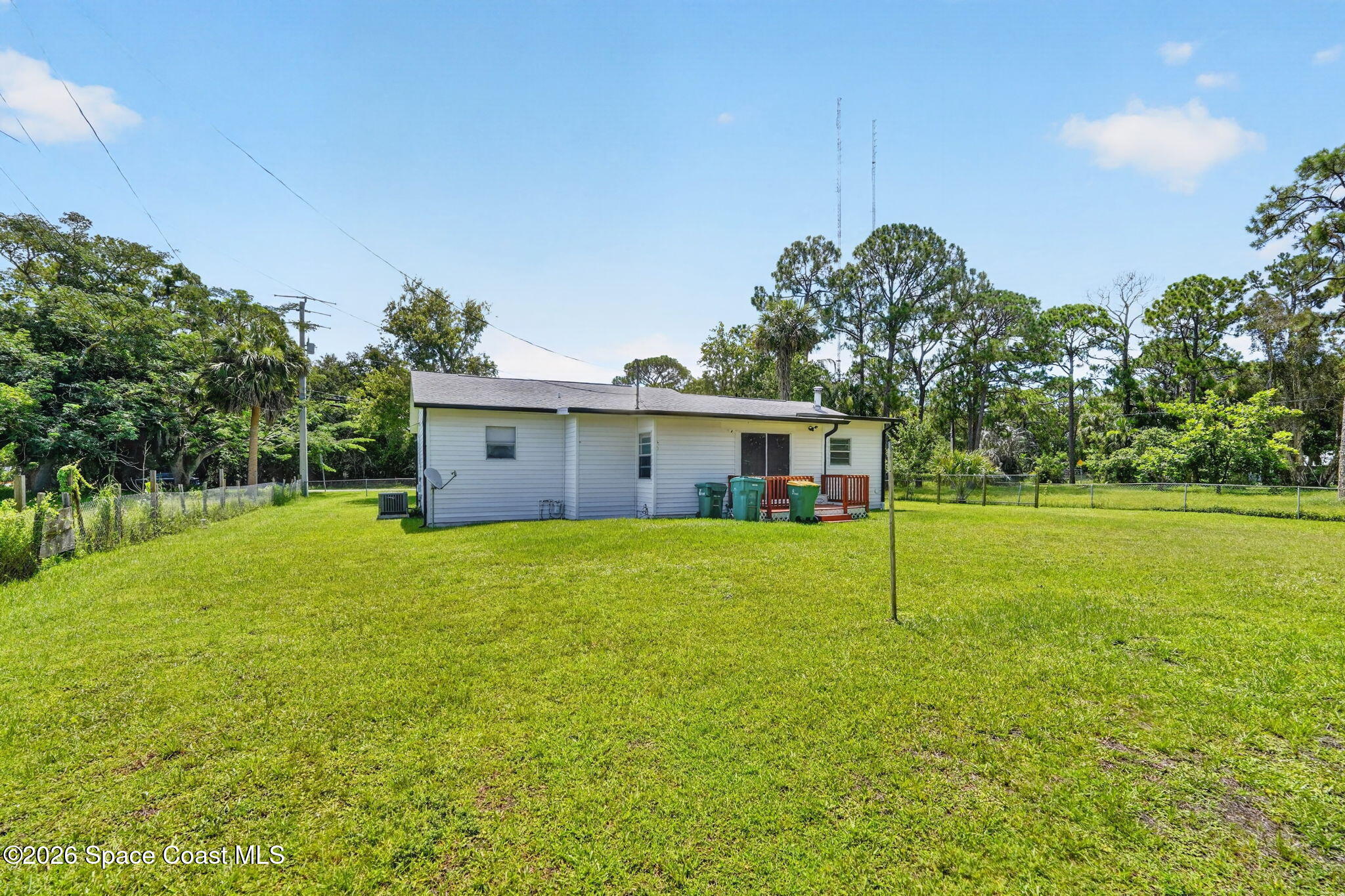 1944 Harlock Road Melbourne, FL 32934 - Photo 43 of 52 Backyard Facing the back of the house