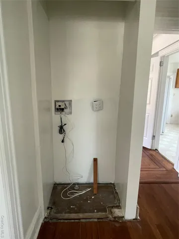 a large kitchen with cabinets and a stove top oven