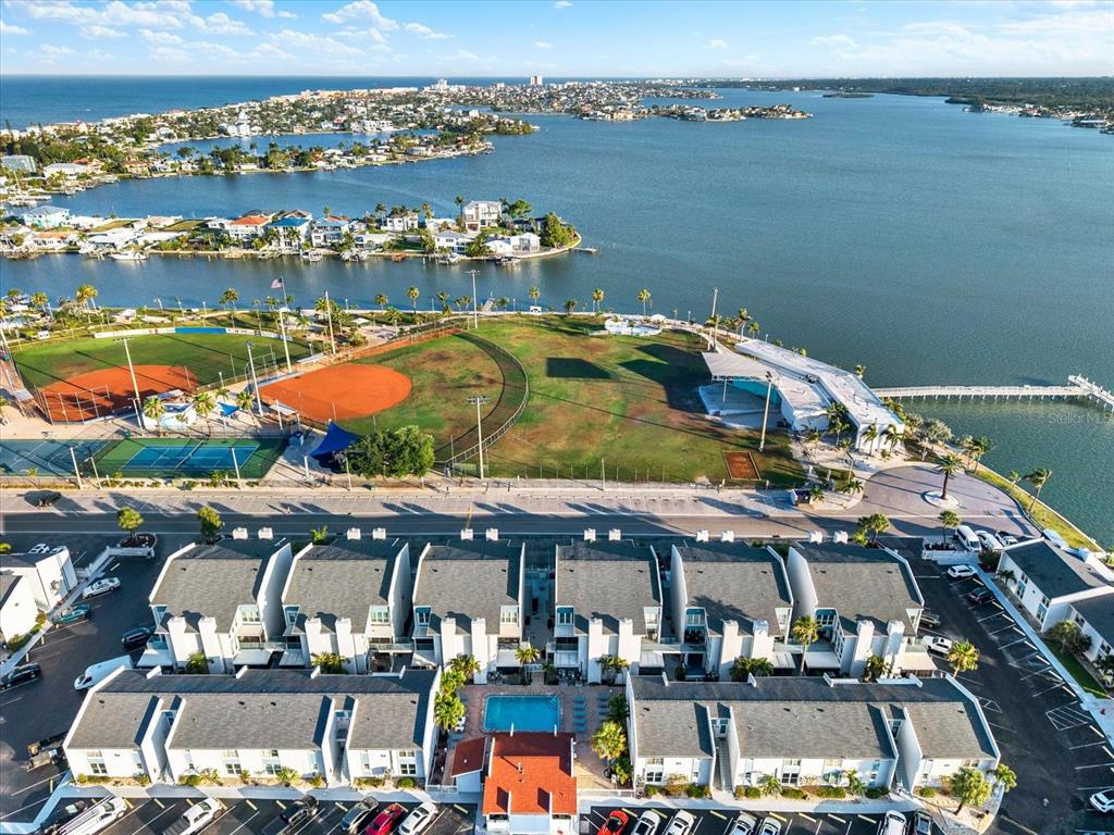337 Rex Place, Unit A Madeira Beach, FL 33708 - Photo 31 of 48 an aerial view of a building with outdoor space