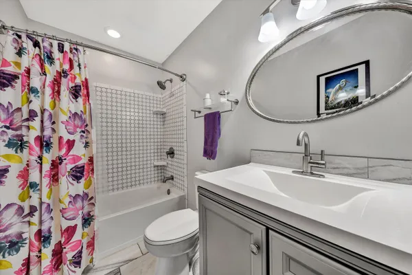 a bedroom with bed and a window