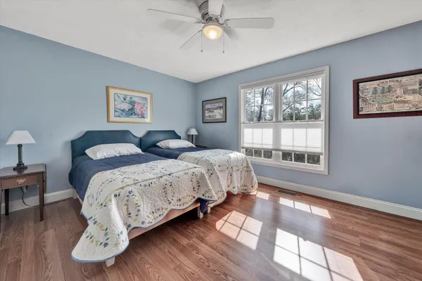 a bedroom with a bed and a table