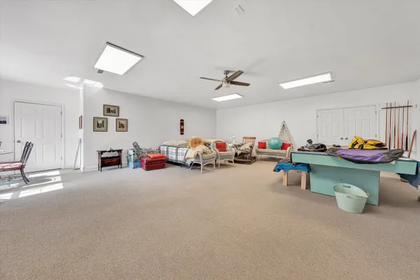 a room with furniture and white walls