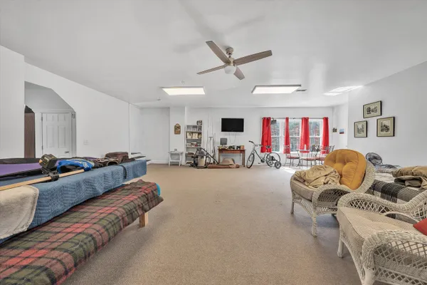 a view of a backyard with plants and a bench