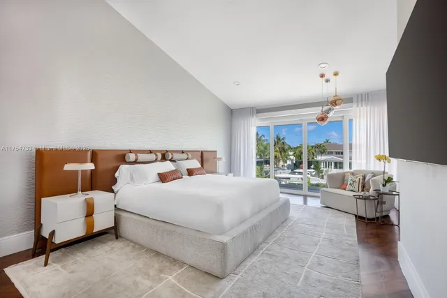 a bedroom with a bed couch and window