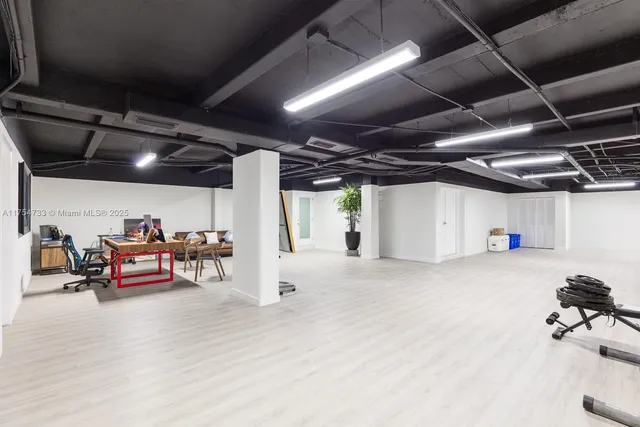 a view of a room with lots of furniture