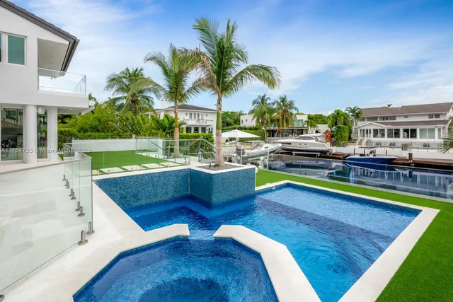 a view of a swimming pool with a lounge chairs